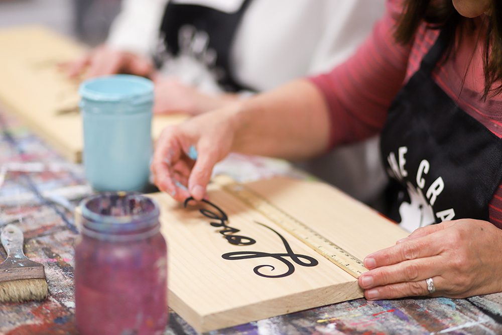 crafting a wooden sign