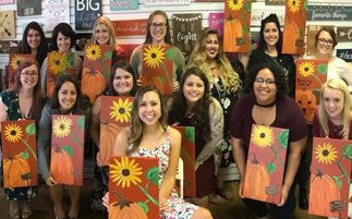 group of ladies with sunflower painting craft